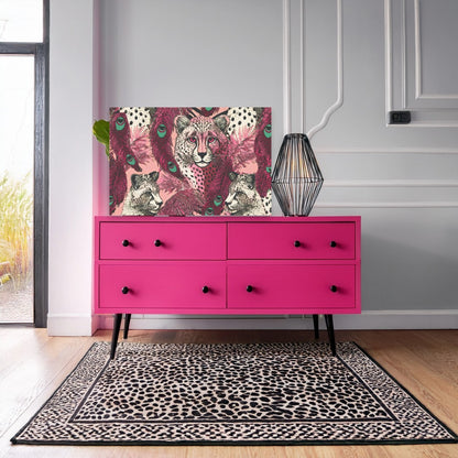 a pink four- drawer dresser with a leopard print rug on the floor in front of it. The dresser has a unique design with a geometric pattern on the front.
